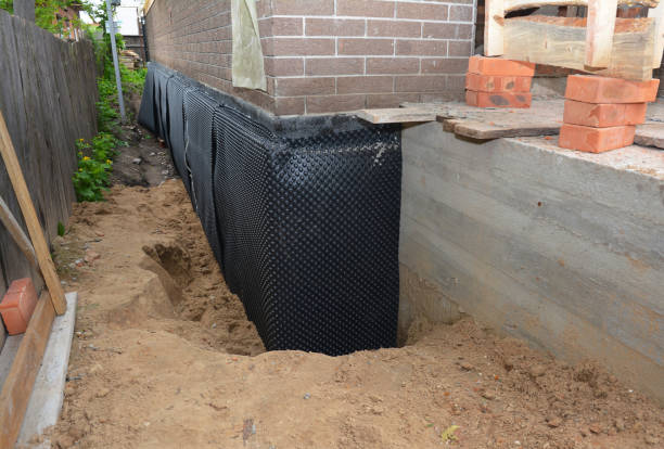 SJ Waterproofing Pros technician performing targeted Exterior Waterproofing assessment in Newton, AL